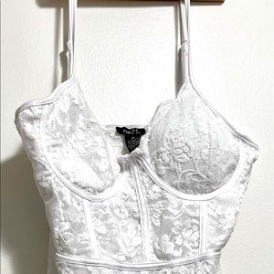 Woman’s white Rue 21 Thong Body suit, never worn, size Medium.